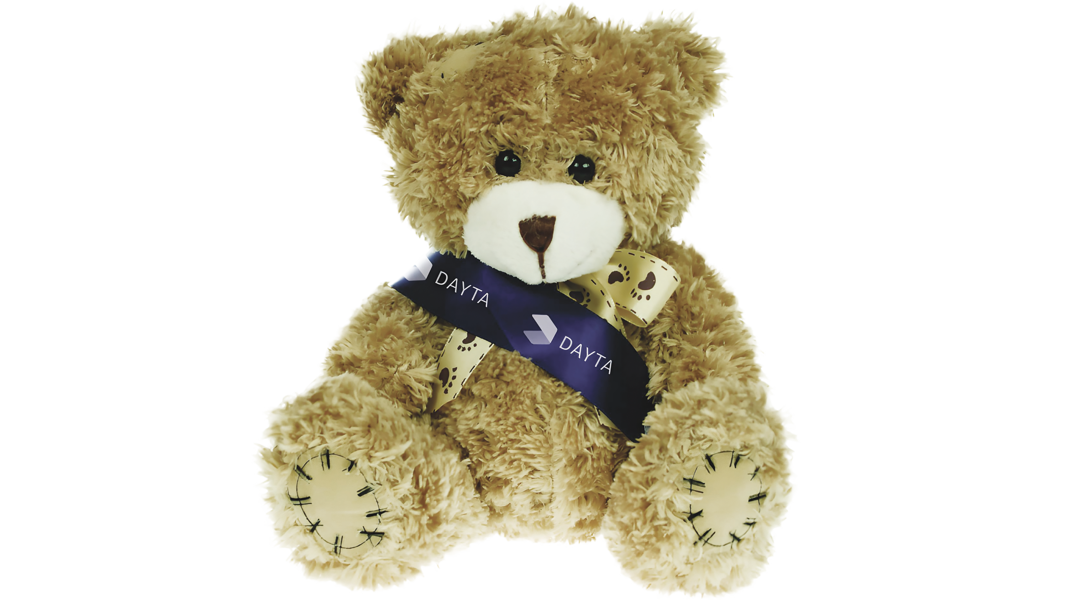 Teddy bear wearing a sash with the Dayta logo